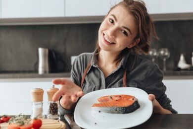 Girl with trout steak
